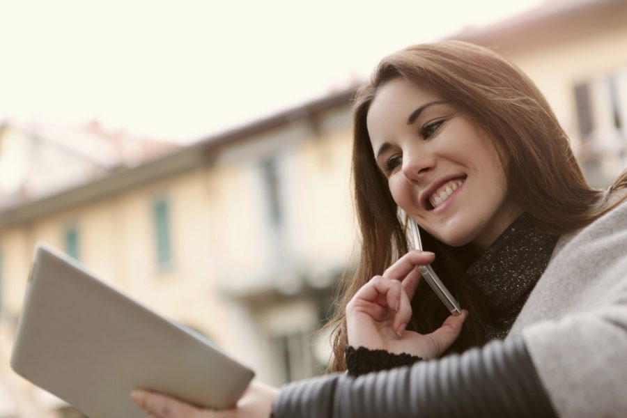 Young woman on phone speaking with asset manager