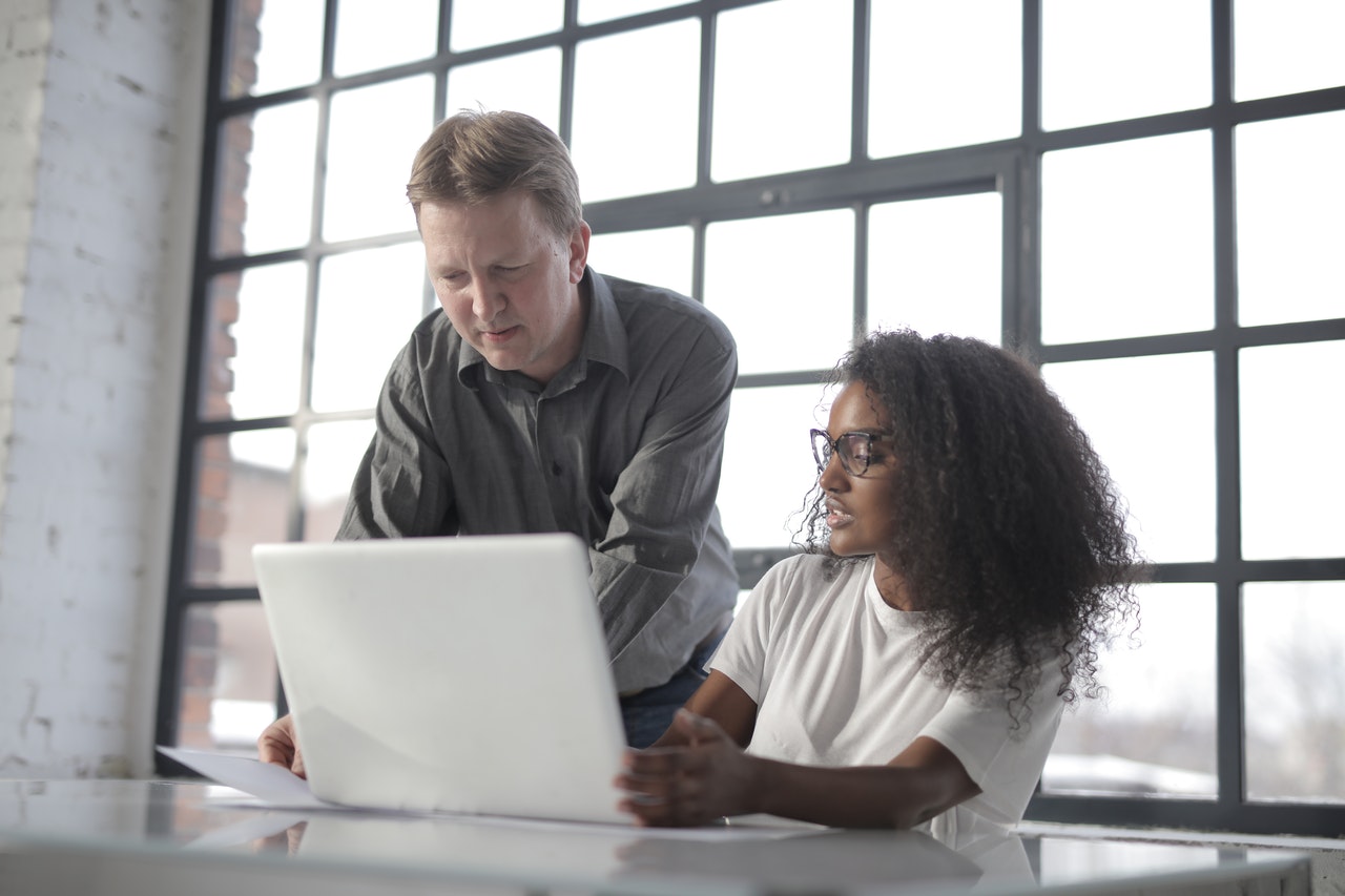 Woman meeting with her male financial advisor.