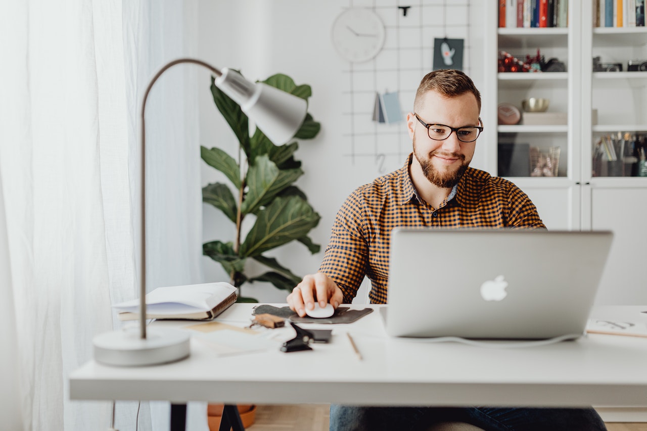 man on laptop looking at financial planning strategy