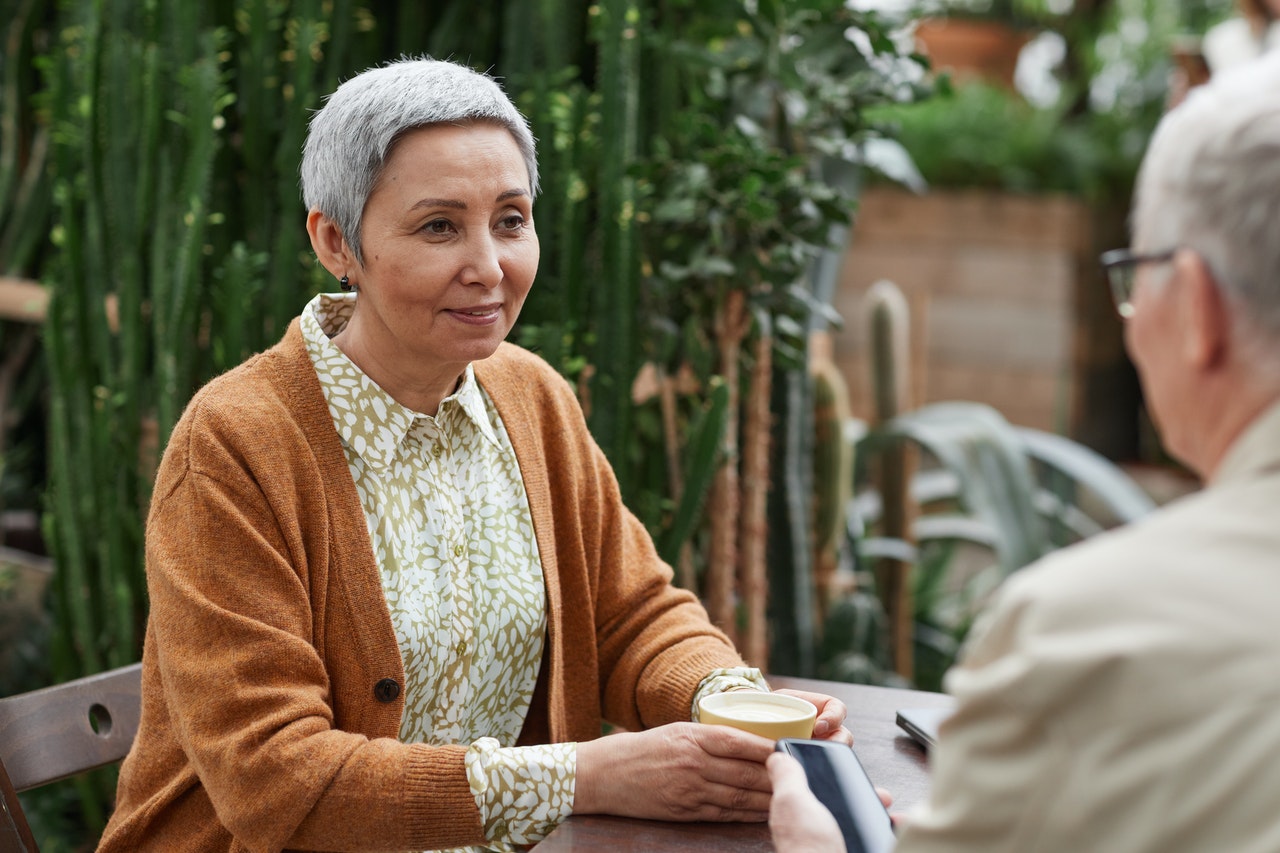 older woman sitting with husband discussing types of deferred compensation plans